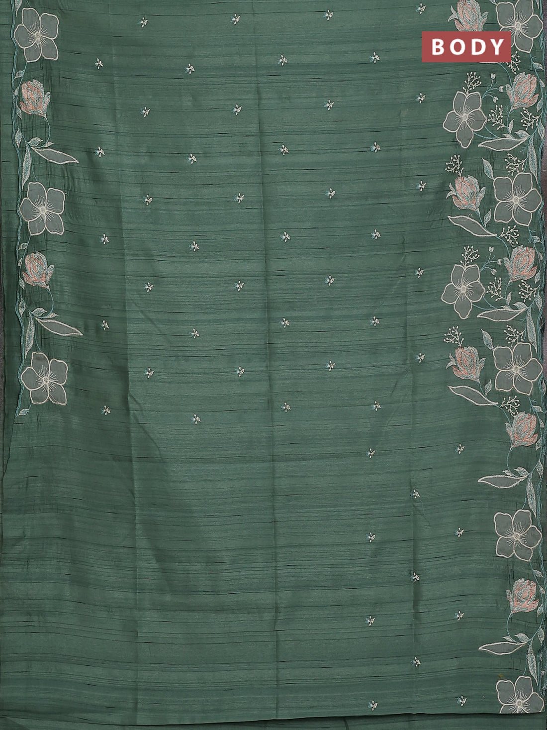Semi raw silk saree green shade with embroidery work buttas and floral embroidery border