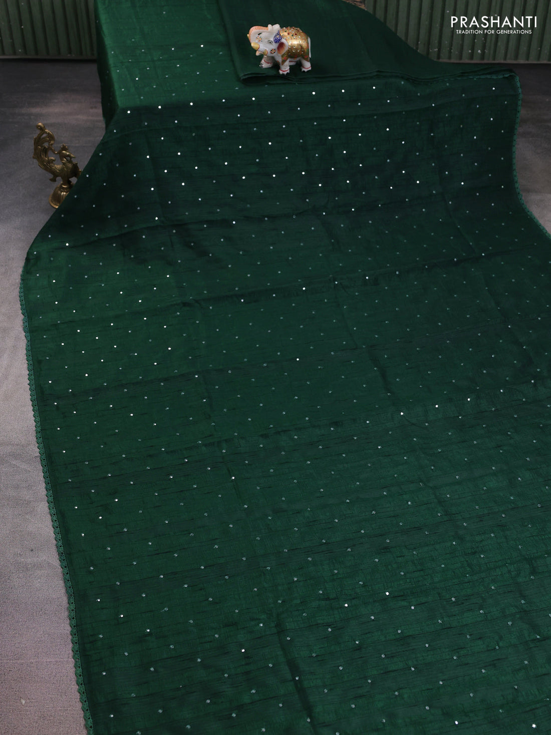 Semi raw silk saree green with allover mirror work and lace work border